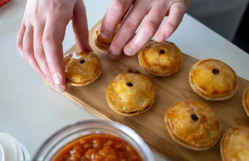 Mini tourtieres on a cutting board